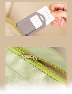 Detail of grey luggage tag with clear ID window and green honeycomb texture storage bag
