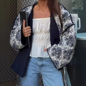 Vintage V-neck printed jacket with black and white patterns for a casual autumn style