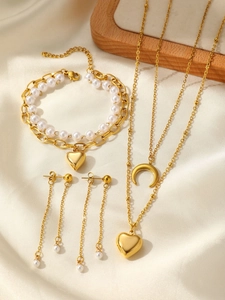 Detailed set of double necklaces with moon heart pendants and pearl chain bracelets