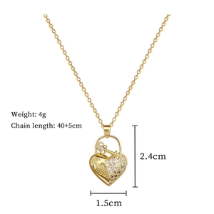 Detail of gold heart lock necklace with LOVE YOU engraving and product dimensions