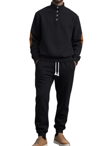 Detail of men's black knit set with brown elbow patches and textured waffle pattern