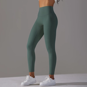 Side view of dark green high-waisted yoga leggings with seamless and slimming fit fabric