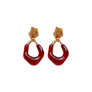 Oval resin drop earrings with gold irregular metal studs and reddish brown pendants