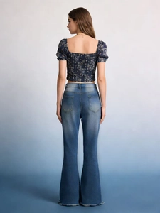 Deep blue floral puff sleeve top with high waisted flare jeans and raw hem finish
