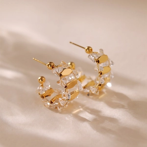 Elegant gold-plated C-shaped stud earrings with clear sparkling zircon crystals