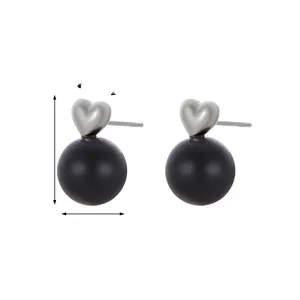 Detailed view of silver heart earrings with black pearl bead including size measurements