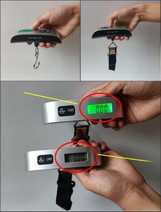 Macro detail of portable luggage scale showing 50kg capacity LCD and strap options