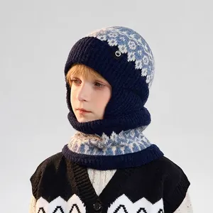 Blue knitted winter hat and scarf set for kids with snowflake patterns and ear protection