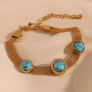 Detail of 18K gold-plated mesh bracelet with turquoise stones and Roman numerals