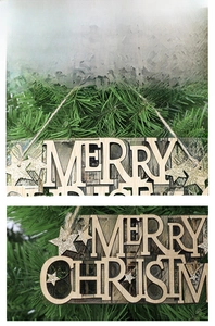 Close-up of Merry Christmas wooden cutout sign with gold glitter star and hemp rope