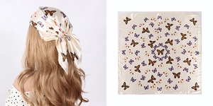Detailed view of beige butterfly print silk scarf shown as headscarf and flat layout