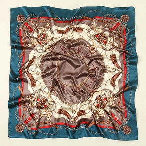 Detailed macro view of vintage chain print on luxurious satin silk square scarf