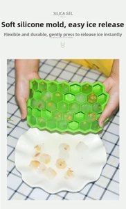 Green 37-grid honeycomb silicone ice tray showing easy flexible release of fruit ice cubes