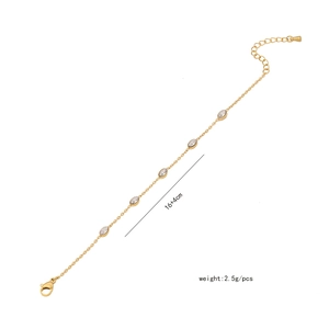 Detail of gold chain bracelet with five oval zircons and lobster clasp closure