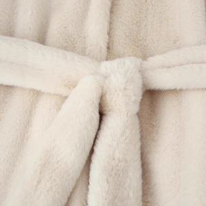 Faux fur coat in light beige featuring a stylish waist belt with soft plush fabric texture