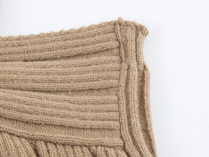 Close-up of khaki chunky knit texture and premium ribbed finish on the cardigan