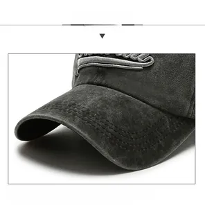Close-up of vintage washed canvas baseball cap featuring thick brim and 3D embroidery detail