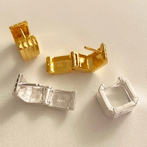 Detailed view of square geometric S925 silver hoop earrings in gold and silver finishes