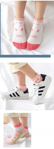 Close-up of mesh breathable kids cotton socks featuring bunny and pink floral patterns