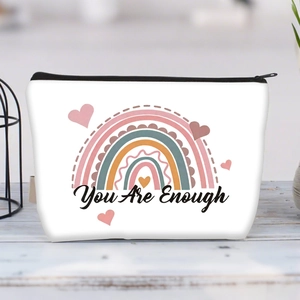 Detailed macro view of white canvas pouch featuring You Are Enough rainbow print