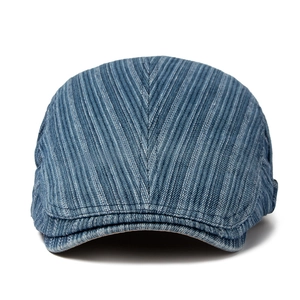 Vintage denim flat cap for men with blue herringbone pattern and structured cotton peak