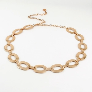 Detailed view of adjustable golden metal waist chain with interlocking oval links