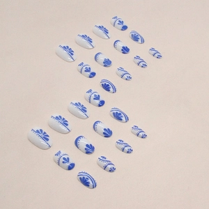 Oval blue and white porcelain style press-on nails with Chinese floral art patterns