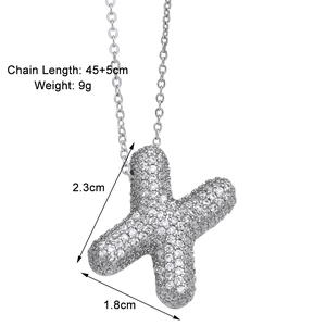 Macro shot of silver letter X pendant with cubic zirconia, 45+5cm chain specifications