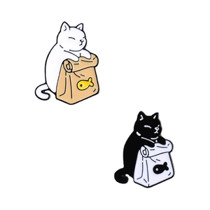 Cute black and white cat enamel pins with fish bag design on minimalist background