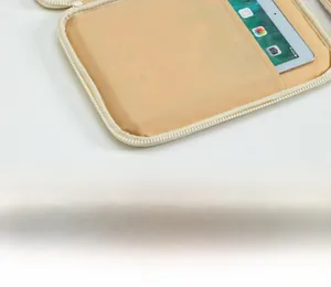 Detailed view of large capacity tablet sleeve with beige scratch-resistant fabric lining