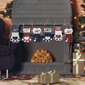 Set of 6 pet Christmas stockings with paw and bone designs in classic buffalo plaid patterns