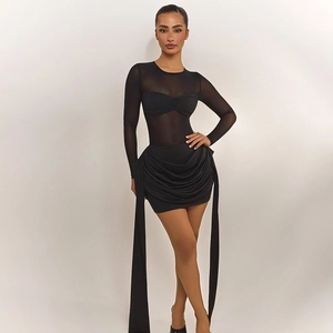 Detail view of women's black mesh long sleeve top with ruched bodycon skirt set