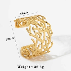 Detail view of gold stainless steel wide cuff bracelet with coral texture and dimensions
