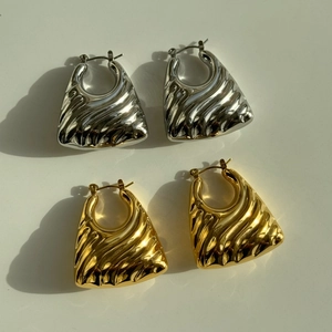 Vintage trapezoid gold and silver hoop earrings with irregular wave texture