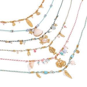 Bohemian style colorful woven necklaces set with sea shells and nautical pendants