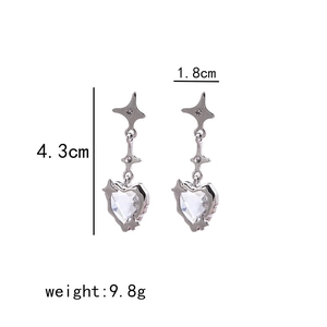 Detailed view of silver heart earrings with star motifs, measuring 4.3cm in length