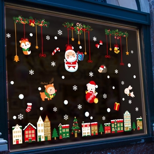 Christmas window decals with Santa Claus and winter animals on glass for holiday decoration