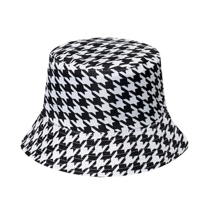 Classic houndstooth bucket hat in black and white pattern for women's sun protection