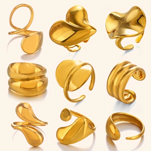 Set of chunky geometric gold stainless steel rings with minimalist mirror finish design