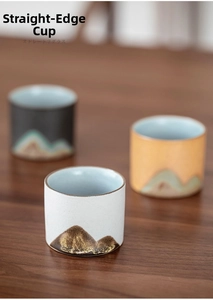Detail view of Japanese-style ceramic tea cup featuring minimalist mountain pattern design