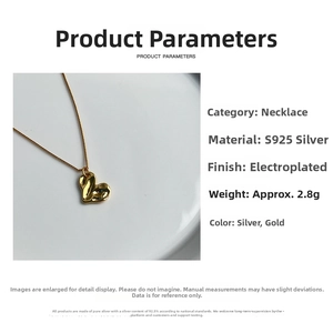 Detail of S925 sterling silver heart necklace showing textured gold plating and weight data