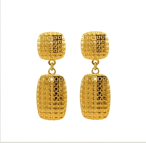 Detailed view of gold square checkered stainless steel earrings with textured surface