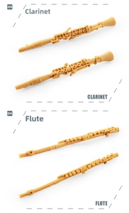 Detailed miniature model of clarinet and flute with realistic keywork in ginger finish