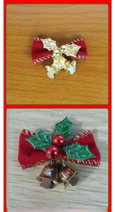 Detail of red velvet Christmas bows with gold and green metallic leaves and mini bells