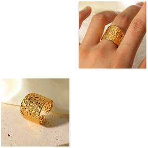 Macro detail of wide gold ring featuring vintage hammered texture and adjustable band