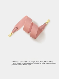 Detail of 5cm pink woven shoulder strap with golden metal buckles and leather ends