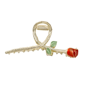 Large golden metal hair claw clip featuring an elegant red rose and green leaf branch