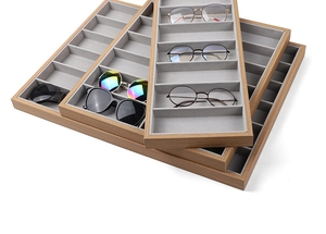Stackable wooden eyewear display tray with grey velvet lining for sunglasses storage