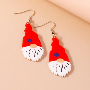 Close-up of cute Christmas gnome acrylic drop earrings in red and white on pink background