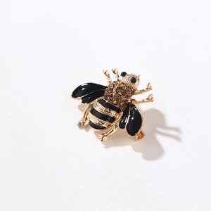 Vintage bee brooch pin with gold and black enamel finish featuring sparkling rhinestones